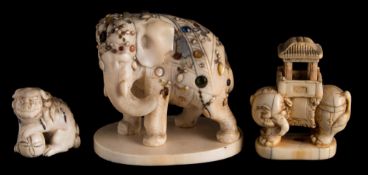A group of three Japanese ivory okimonos: including a shibayama ivory standing elephant,