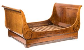 An early 19th Century French elm, maple and partridgewood marquetry double bed:,