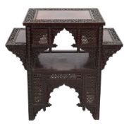 An Indian carved hardwood rectangular occasional table:, with twin graduated side tiers,
