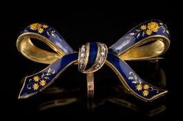 An 18ct gold and diamond mounted blue enamelled 'ribbon' brooch: approximately 43mm long,