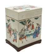 A Chinese famille rose porcelain oblong box and cover: painted overall with dignitaries and