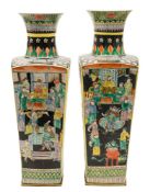 A pair of Chinese famille noire vases: of tapering square section, painted with officials,