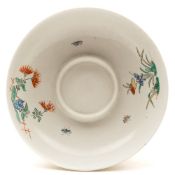 A Chantilly trembleuse saucer: painted in the Kakiemmon palette with two floral sprays and