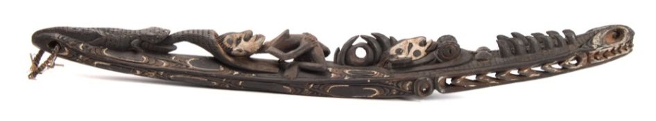 A 20th century Sepik (Papua New Guinea) house sculpture: in the form of a canoe,