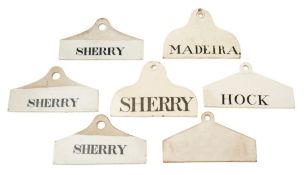 A group of seven English creamware bin labels: of 'coat hanger' form,