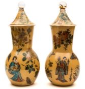 A matched garniture of decalcomania glass vases: interior decorated with coloured prints of figures,