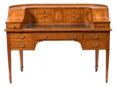 By Maple & Co An Edwardian satinwood and inlaid Carlton House writing desk:,