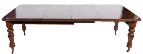 A Victorian mahogany extending dining table:, with a telescopic action,