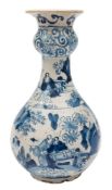 A Dutch blue and white delft garlic-necked bottle vase: painted with oriental figures in landscapes