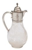 A Victorian silver mounted claret jug, makers mark worn, London, 1881: crested, of ovoid form,
