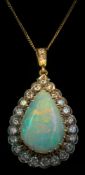 An opal and diamond pear-shaped pendant: the central pear-shaped opal approximately 22mm long x