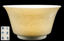 A Chinese anhua dragon bowl: with flared rim, the exterior carved with two dragons,