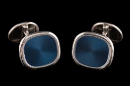 A pair of 'Patek Philippe' 18ct white gold 'Ellipse' cuff-links: the central polished blue plaques