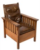 An Arts and Crafts 'Morris' oak armchair in the manner of Gustav Stickley:,
