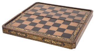 A 19th century Chinese black lacquer folding chess/backgammon board: the external chess board