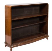 A mid 20th Century Indian rosewood open bookcase:, with curved top,