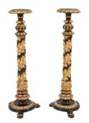 A pair of Regency carved giltwood and ebonised jardiniere stands:,