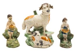 Three creamware press moulded figures: comprising a ram and lamb group and two figures holding