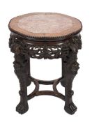 A Chinese carved hardwood jardiniere stand:, of lobed circular outline,