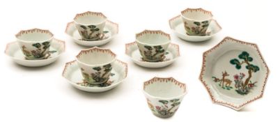A set of six Chinese famille rose/verte octagonal tea bowls and saucers: painted with a stag