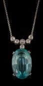 An aquamarine and diamond lavalier: the single oval aquamarine approximately 21.5mm long x 13.