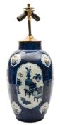 A Chinese porcelain vase: of slender oviform decorated with panels containing household and