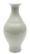 A Chinese pale celadon glazed vase: of baluster form with pear shaped body and flared rim,