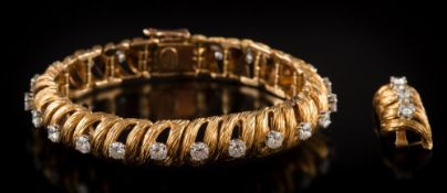 A diamond mounted bracelet: of textured openwork links,