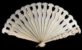 A Continental carved ivory brise fan: the guards carved with classical female figures holding aloft
