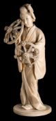 A large Japanese carved sectional ivory okimono,