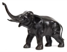 A large Japanese bronze model of an elephant: with raised trunk and open mouth, unsigned, 54cm.