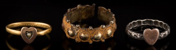 An antique gilt bronze posy ring: moulded with a continuous series of domes and beads engraved