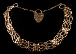 A 9ct gold gate-link bracelet: with padlock clasp and safety chain, 19gms gross weight.