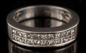 An 18ct white gold and princess-cut diamond half-hoop ring: with two rows of 'invisibly-set'