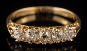 A graduated diamond five-stone ring: the round old,