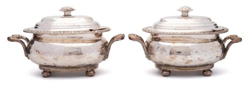 A pair of Sheffield plate tureens and covers: of oval outline with domed lift-off lids,