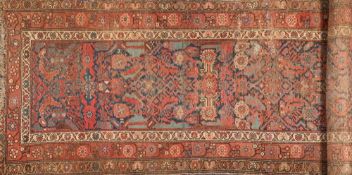 A Caucasian runner:, the indigo Herati field enclosed by a main brick red flowerhead meander border,