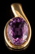 An oval amethyst single-stone pendant: the oval amethyst approximately 20mm x 15mm in a four-claw