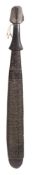 A Trobriand Island club: the flattened blade decorated with incised rows of geometric scrolling