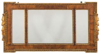 A walnut and partly gilt landscape wall mirror: of rectangular broken outline,