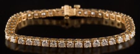 A diamond line bracelet: set with round, brilliant-cut diamonds estimated to weigh a total of 4.