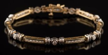 A modern diamond line bracelet: with round, brilliant-cut diamonds and stamped '14K',