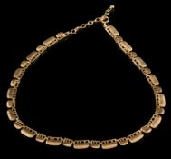 A 9ct gold textured-link necklace: of pierced design approximately 25.5gms gross weight.