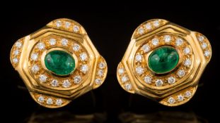 A pair of oval emerald and diamond stud/clip earrings: each centring an oval cabochon emerald