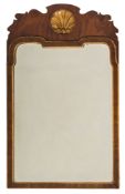 A 19th Century walnut and partly gilt wall mirror:, in the early 18th Century manner,