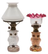 Two Continental table lamps in the form of owls: each seated bird with glass eyes,