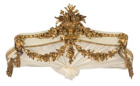 A carved wood and cream and gilt decorated serpentine fronted canopy:,