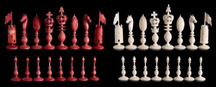 A 19th century carved ivory 'Burmese' type chess set: one side stained red the other left natural,