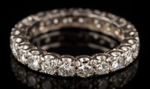 A diamond eternity ring: with twenty-two circular,