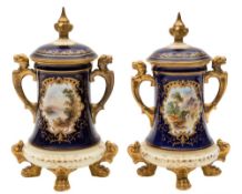 A pair of Coalport jars and covers: of tapering form set on four lion paw feet,